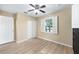 Bedroom with a ceiling fan, window with shutters, and closet at 8 Banyan Dr, Ocala, FL 34472