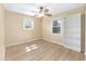 A bedroom with hardwood floors, a ceiling fan, and a window with blinds at 8 Banyan Dr, Ocala, FL 34472
