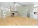 Open living room with vaulted ceiling, wood flooring, and a unique fireplace, ideal for entertaining at 8 Banyan Dr, Ocala, FL 34472