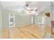 Spacious living area with high ceilings, wood floors, and French doors leading to the backyard at 8 Banyan Dr, Ocala, FL 34472