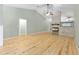 Bright living room with wood flooring, vaulted ceilings, and a modern fireplace feature at 8 Banyan Dr, Ocala, FL 34472