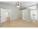 Primary bedroom boasts ample space, a ceiling fan, and access to the bath and closet at 8 Banyan Dr, Ocala, FL 34472