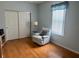 Cozy bedroom showcasing a window with plenty of natural light and wood flooring at 9019 Se 120Th Loop, Summerfield, FL 34491