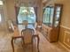 Traditional dining room featuring a wooden table, matching chairs, and built-in china cabinet at 9019 Se 120Th Loop, Summerfield, FL 34491