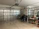 Spacious garage with insulated doors, offering ample storage and workspace at 9019 Se 120Th Loop, Summerfield, FL 34491