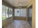 Relaxing sunroom with tiled floors and multiple windows, perfect for year-round enjoyment at 9019 Se 120Th Loop, Summerfield, FL 34491