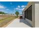 Exterior view of the home showcasing the covered lanai and landscaped backyard at 9923 Sw 98Th Ln, Ocala, FL 34481