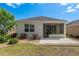 Charming home with a well-maintained backyard featuring a screened patio and lush greenery at 9923 Sw 98Th Ln, Ocala, FL 34481