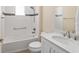 Bathroom featuring a tiled tub, shower, white vanity, and decorative accents at 9923 Sw 98Th Ln, Ocala, FL 34481