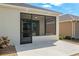 Exterior view of home with a screened patio and access to the backyard at 9923 Sw 98Th Ln, Ocala, FL 34481