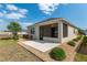 Exterior view of home featuring a screened patio and well-manicured landscaping at 9923 Sw 98Th Ln, Ocala, FL 34481
