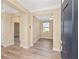 Welcoming foyer featuring stylish wood-look flooring and an open floor plan leading to a bright, airy living space at 9923 Sw 98Th Ln, Ocala, FL 34481