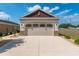 Attached two car garage with a large driveway at 9923 Sw 98Th Ln, Ocala, FL 34481