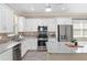 Modern kitchen with granite countertops, stainless steel appliances, and ample storage space at 9923 Sw 98Th Ln, Ocala, FL 34481