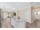 An open kitchen features an island, granite countertops and stainless steel appliances at 9923 Sw 98Th Ln, Ocala, FL 34481