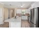 Well-appointed kitchen showcasing granite counters, stainless appliances, and a center island at 9923 Sw 98Th Ln, Ocala, FL 34481