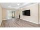 Inviting living area featuring sliding glass doors, wood floors, and a bright, open layout at 9923 Sw 98Th Ln, Ocala, FL 34481
