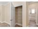 Walk-in pantry providing ample storage space with wire shelving, conveniently located near the bathroom at 9923 Sw 98Th Ln, Ocala, FL 34481