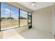 Screened patio with ceiling fan provides a relaxing outdoor living space at 9923 Sw 98Th Ln, Ocala, FL 34481