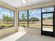 Screened patio offering a comfortable space and picturesque views of the surrounding landscape at 9923 Sw 98Th Ln, Ocala, FL 34481