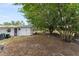 Expansive backyard with mature trees, a storage shed, and a fenced perimeter at 9940 Sw 103Rd Pl, Ocala, FL 34481