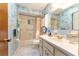 Full bathroom with floral wallpaper, shower-tub combo, and a single sink vanity at 9940 Sw 103Rd Pl, Ocala, FL 34481