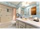 Full bathroom with floral wallpaper, shower-tub combo, and a single sink vanity at 9940 Sw 103Rd Pl, Ocala, FL 34481
