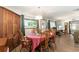 Dining room with wood furniture and natural light with a view into the living room at 9940 Sw 103Rd Pl, Ocala, FL 34481