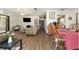 Open-concept living room and dining area featuring modern flooring and natural light at 9940 Sw 103Rd Pl, Ocala, FL 34481