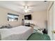 Standard bedroom with a ceiling fan, carpeted floors, and a window with pleasant view at 5245 Nw 21St Loop, Ocala, FL 34482