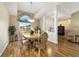 Cozy dining area with wood floors, natural light, decorative pillars, and a view to the backyard at 5245 Nw 21St Loop, Ocala, FL 34482