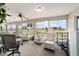 Bright Florida room with plush seating and panoramic views of the golf course at 5245 Nw 21St Loop, Ocala, FL 34482