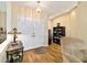 Inviting foyer featuring wood floors, a double-door entry, and neutral wall colors at 5245 Nw 21St Loop, Ocala, FL 34482