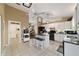 Bright kitchen features a central island, sleek black appliances, and ample white cabinetry at 5245 Nw 21St Loop, Ocala, FL 34482