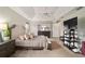 Comfortable main bedroom featuring neutral tones, a tray ceiling, and an ensuite bathroom at 5245 Nw 21St Loop, Ocala, FL 34482