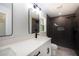 Contemporary bathroom showcasing dual rain shower, sleek fixtures and vanity at 112 Juniper Run, Ocala, FL 34472