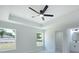 An airy bedroom features a modern ceiling fan and a bright view at 112 Juniper Run, Ocala, FL 34472