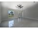 Spacious living room with recessed lights and a large window overlooking a sunny landscape at 112 Juniper Run, Ocala, FL 34472