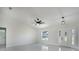 Bright living room featuring neutral walls, modern lighting, and a view of the exterior at 112 Juniper Run, Ocala, FL 34472