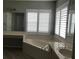 Luxurious bathroom featuring a soaking tub, double windows and a vanity area at 11411 Sw 138Th Ln, Dunnellon, FL 34432