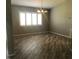 Dining room with wood-look tile flooring, plantation shutters and pendant lighting at 11411 Sw 138Th Ln, Dunnellon, FL 34432