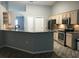 Bright kitchen boasts granite countertops, stainless appliances, wood cabinets and tile flooring at 11411 Sw 138Th Ln, Dunnellon, FL 34432