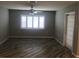 Living room with tile flooring, plantation shutters and ceiling fan at 11411 Sw 138Th Ln, Dunnellon, FL 34432