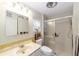 Bathroom features a vanity, toilet, and shower with sliding glass doors at 1179 Se 170Th Ct, Silver Springs, FL 34488