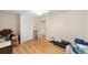 Bedroom with wood floors, white trim and a ceiling fan at 1179 Se 170Th Ct, Silver Springs, FL 34488