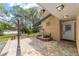 Charming single story home showcasing a brick exterior, small courtyard, and a view of the lake at 1179 Se 170Th Ct, Silver Springs, FL 34488