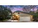 Charming single story home featuring a brick exterior, two car garage, and landscaped front yard at 1179 Se 170Th Ct, Silver Springs, FL 34488