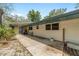 Exterior view featuring a covered patio, showcasing the home's outdoor living space and architectural details at 1179 Se 170Th Ct, Silver Springs, FL 34488