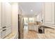 Well-lit kitchen featuring stainless appliances, granite countertops, and custom white cabinetry at 1179 Se 170Th Ct, Silver Springs, FL 34488