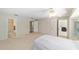 Bright main bedroom with carpeted floors, closet space, and easy access to ensuite bathroom at 1179 Se 170Th Ct, Silver Springs, FL 34488